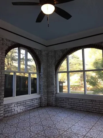 a view of an empty room with a large window