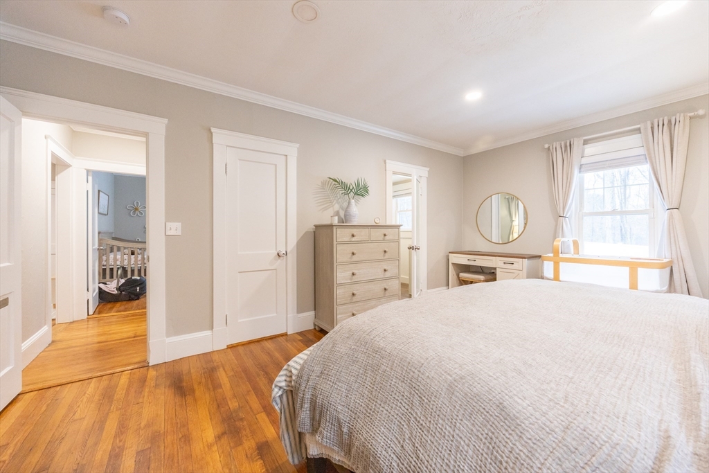 557 Dedham Street Wrentham, MA 02093 - Photo 22 of 42 a bedroom with a large bed and a window