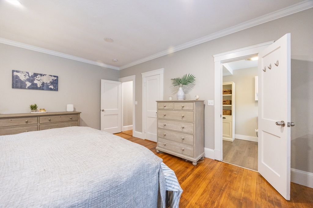 557 Dedham Street Wrentham, MA 02093 - Photo 24 of 42 a bedroom with a bed and a dresser