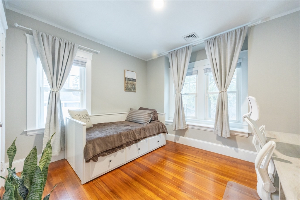 557 Dedham Street Wrentham, MA 02093 - Photo 30 of 42 a bedroom with a bed and next to a window