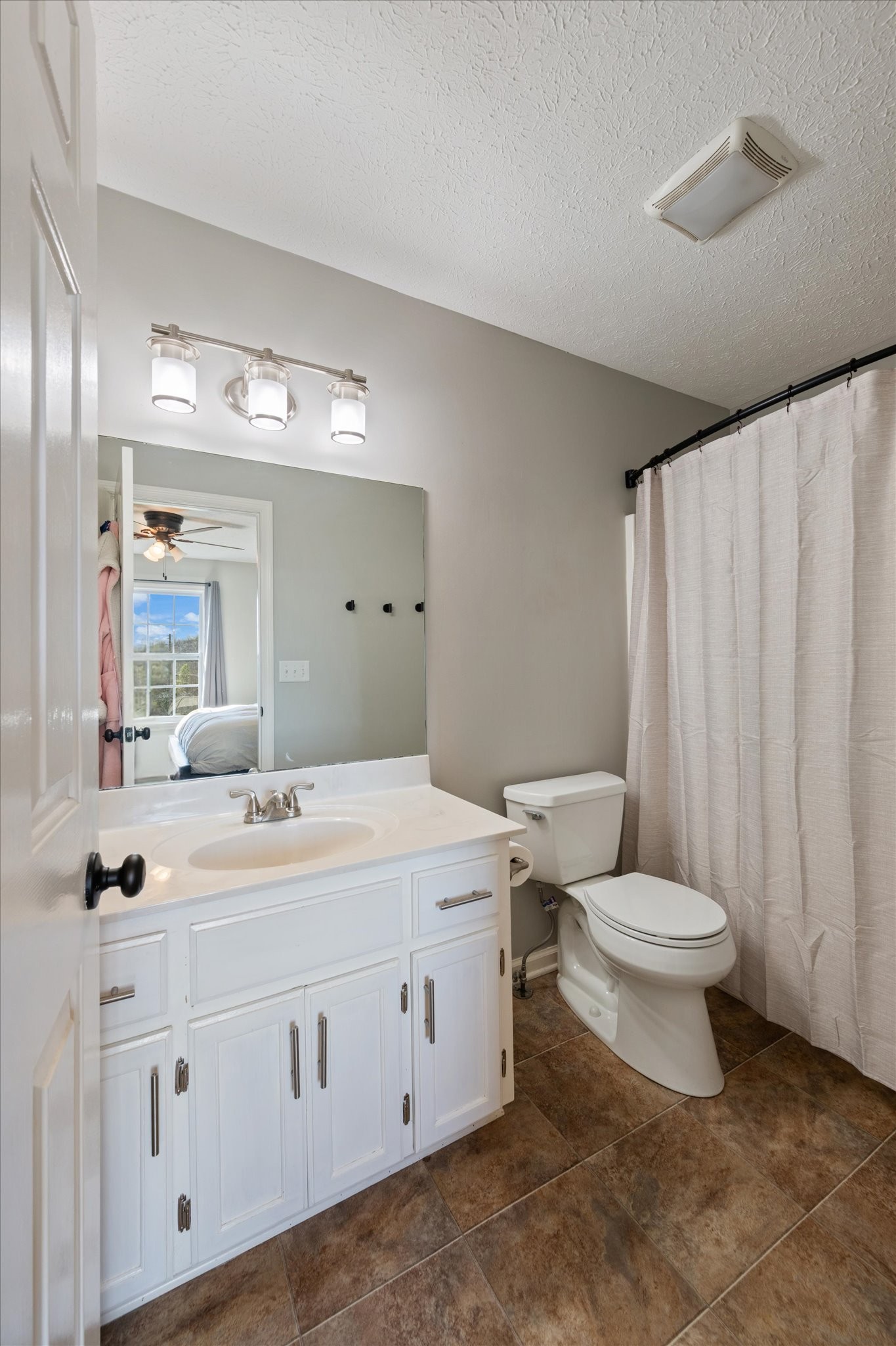 3695 Armstrong Road Springfield, TN 37172 - Photo 32 of 36 a bathroom with a toilet sink and mirror