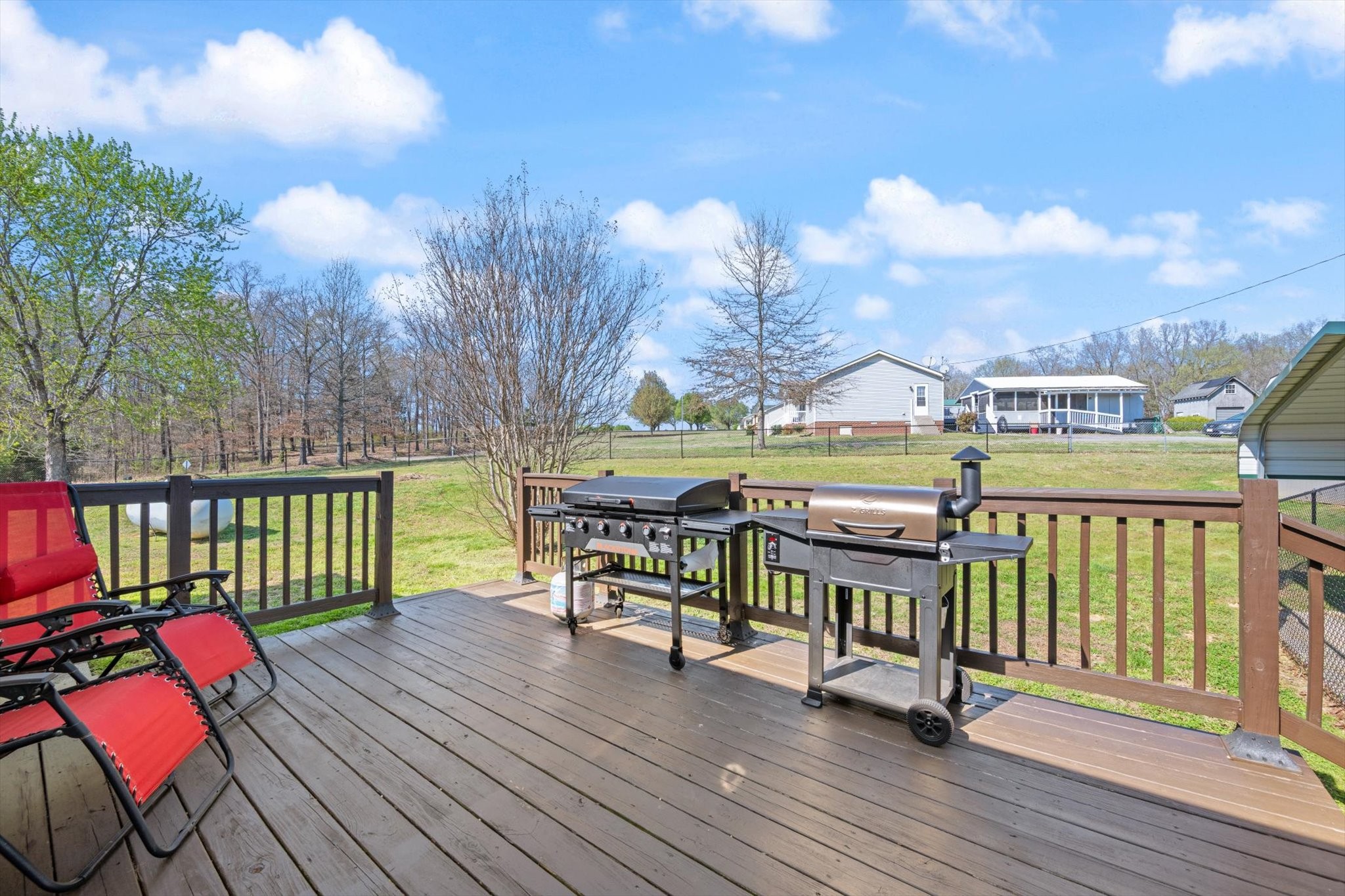 3695 Armstrong Road Springfield, TN 37172 - Photo 9 of 36 a view of a balcony with wooden floor and outdoor seating
