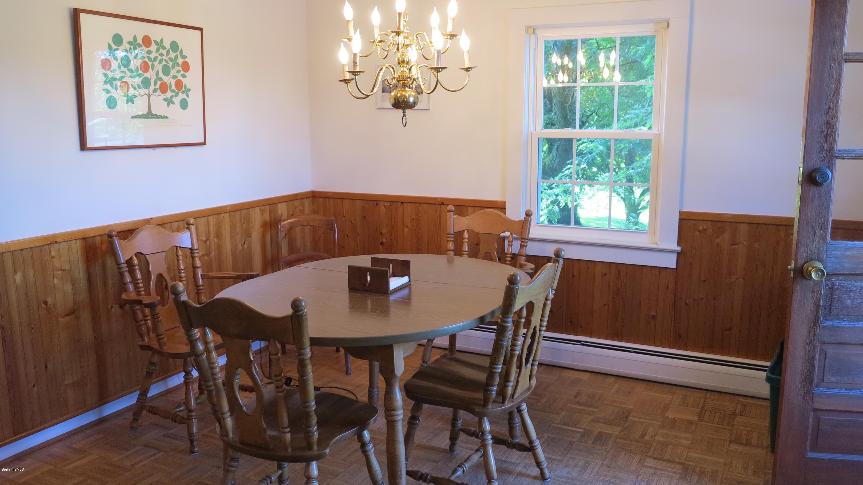 160 Cheever Road Richmond, MA 01254 - Photo 11 of 27 a view of a dining room with furniture a chandelier and wooden floor