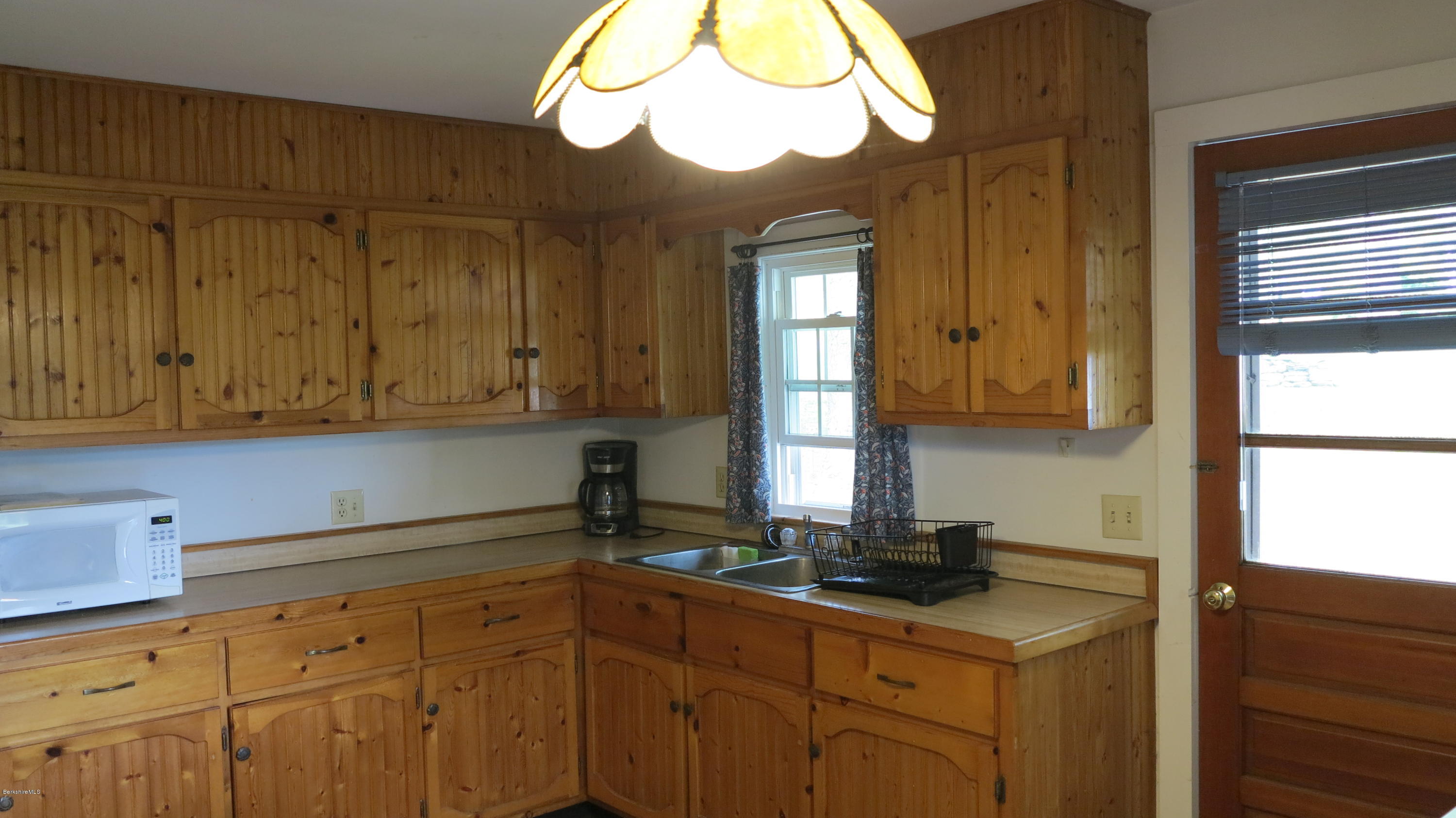 160 Cheever Road Richmond, MA 01254 - Photo 16 of 27 a kitchen with a sink cabinets and a window