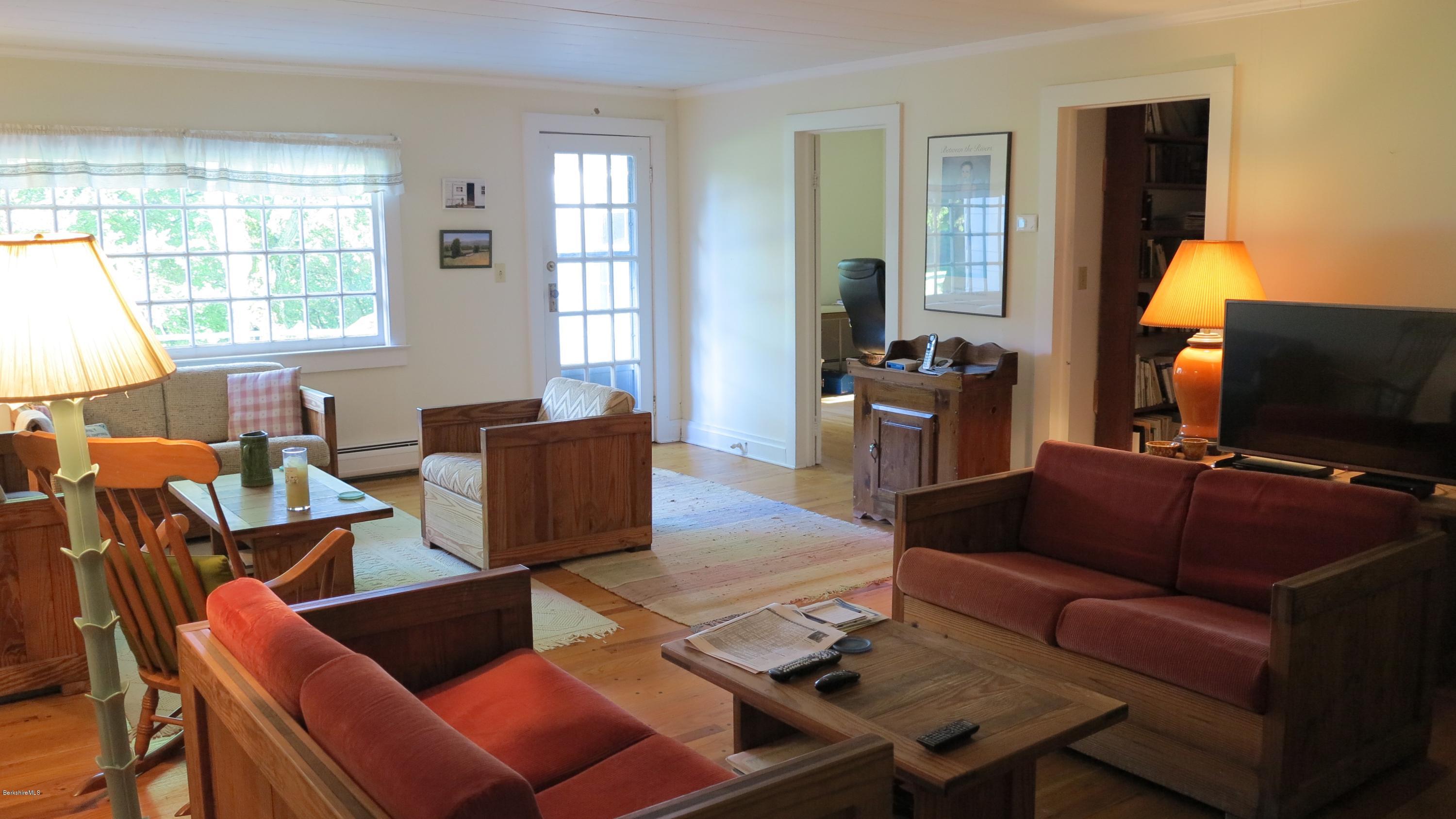 160 Cheever Road Richmond, MA 01254 - Photo 3 of 27 a living room with furniture and a flat screen tv