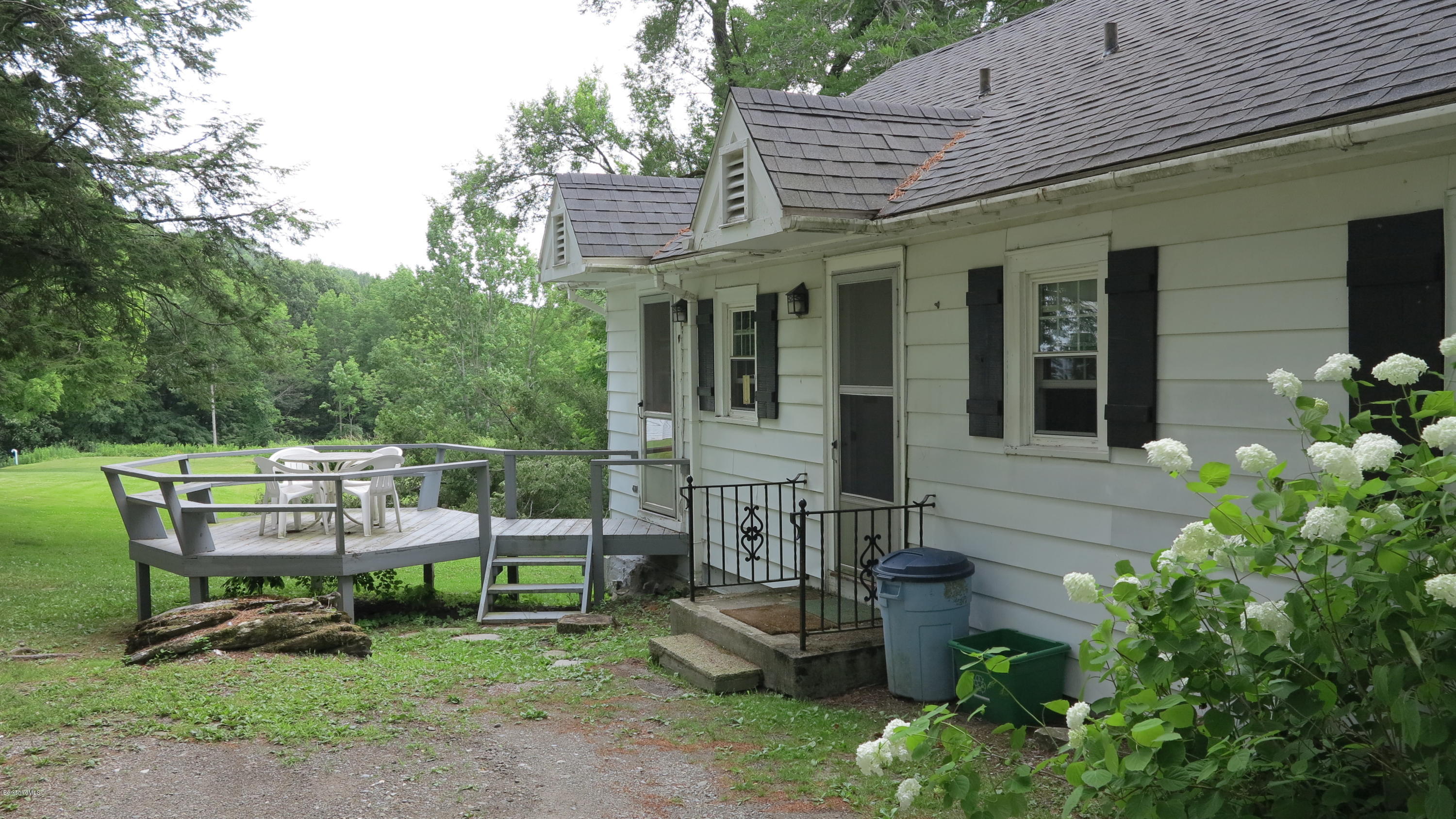 160 Cheever Road Richmond, MA 01254 - Photo 25 of 27 a view of a chair and table in backyard of the house