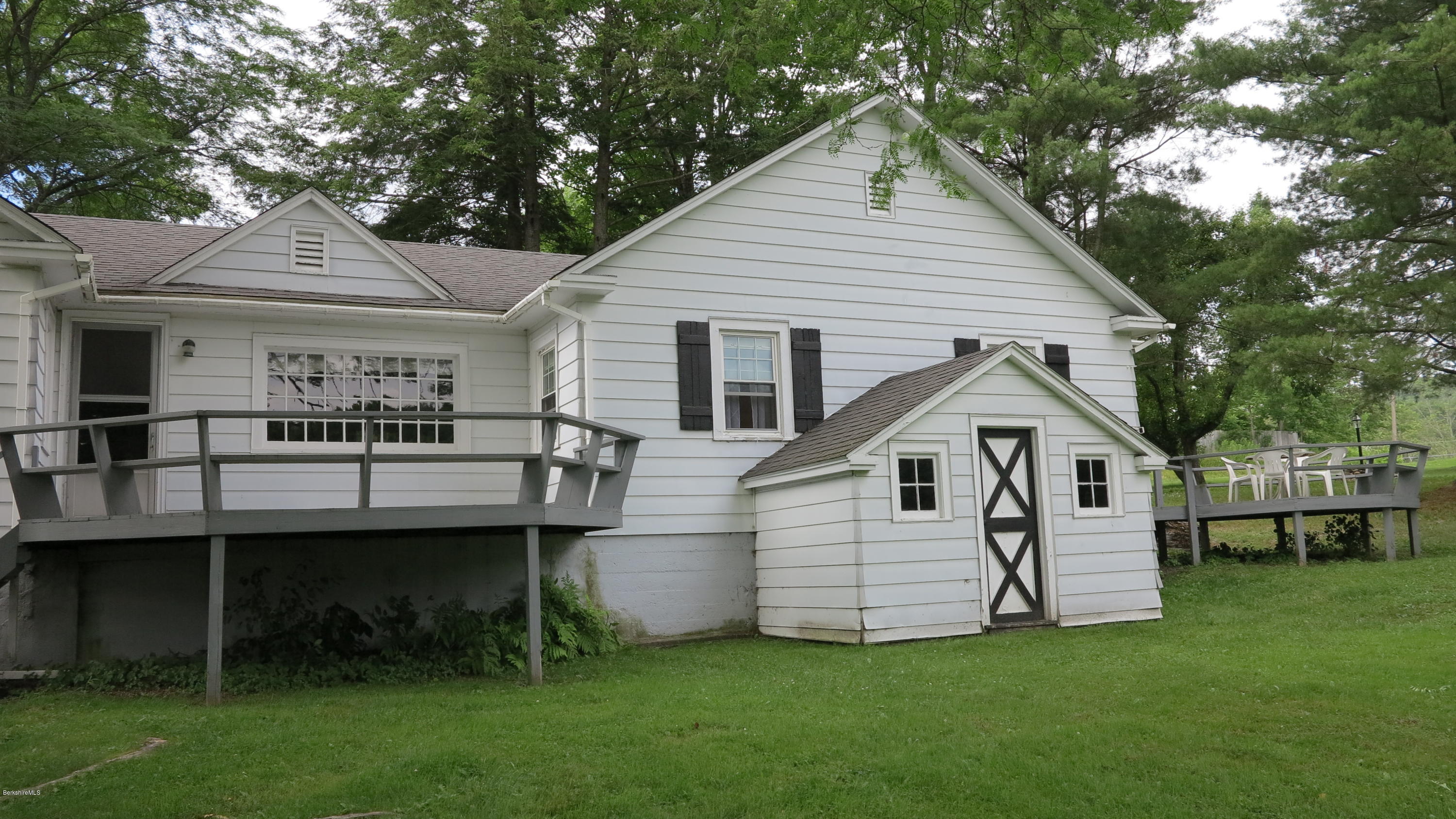 160 Cheever Road Richmond, MA 01254 - Photo 26 of 27 a front view of a house with a garden