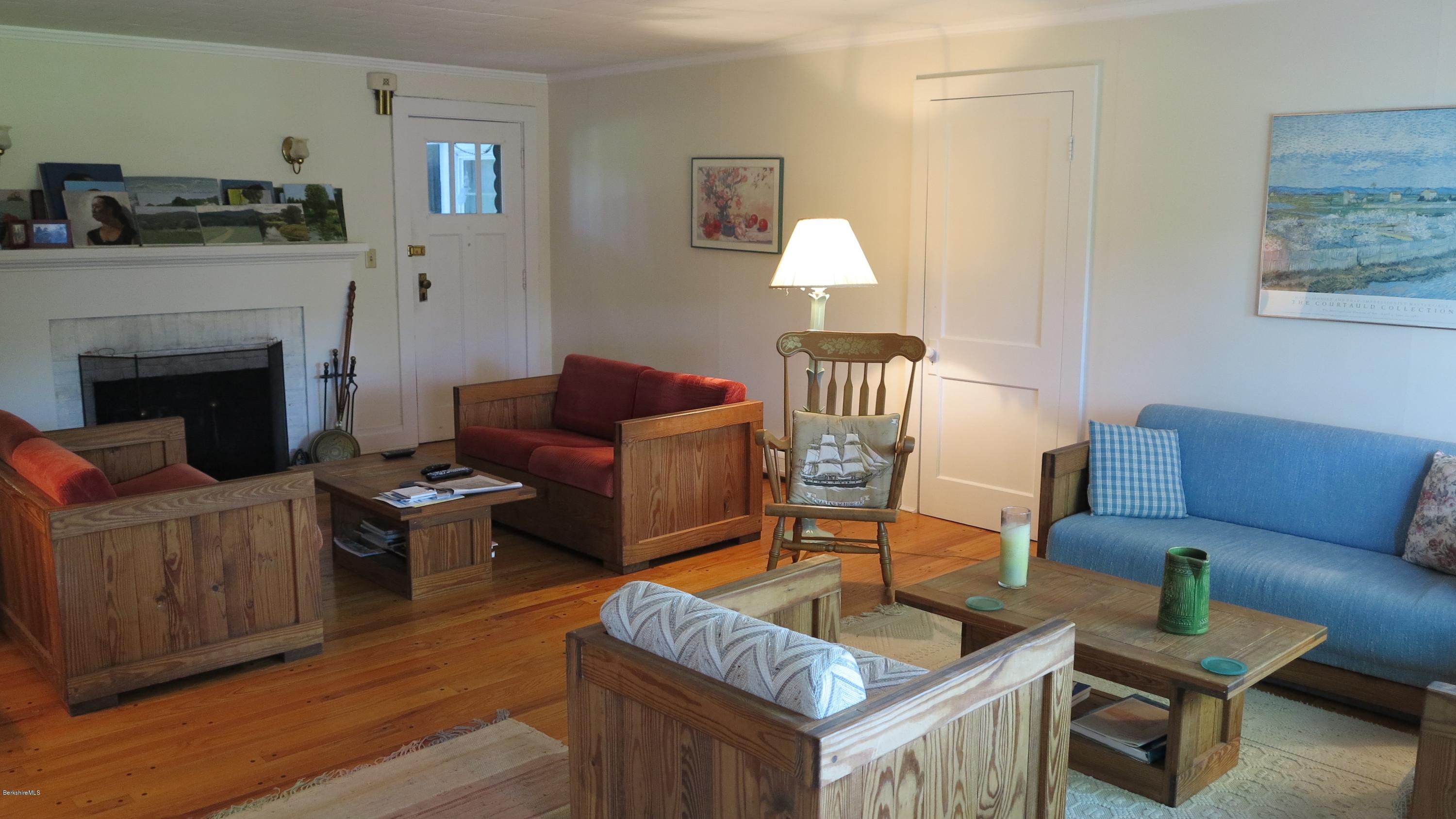 160 Cheever Road Richmond, MA 01254 - Photo 4 of 27 a living room with furniture and a fireplace