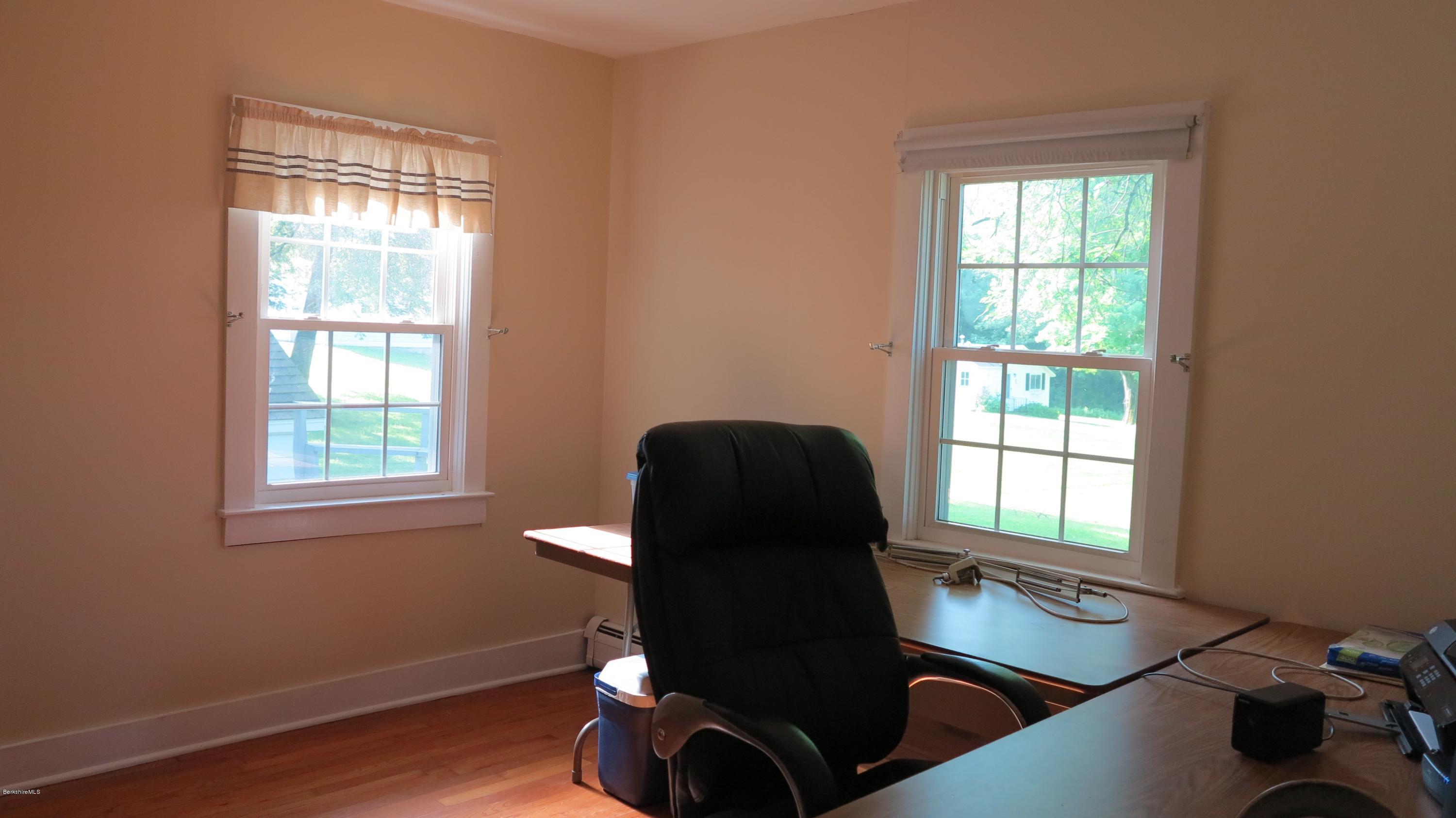 160 Cheever Road Richmond, MA 01254 - Photo 8 of 27 a table chair sitting in a room next to a window