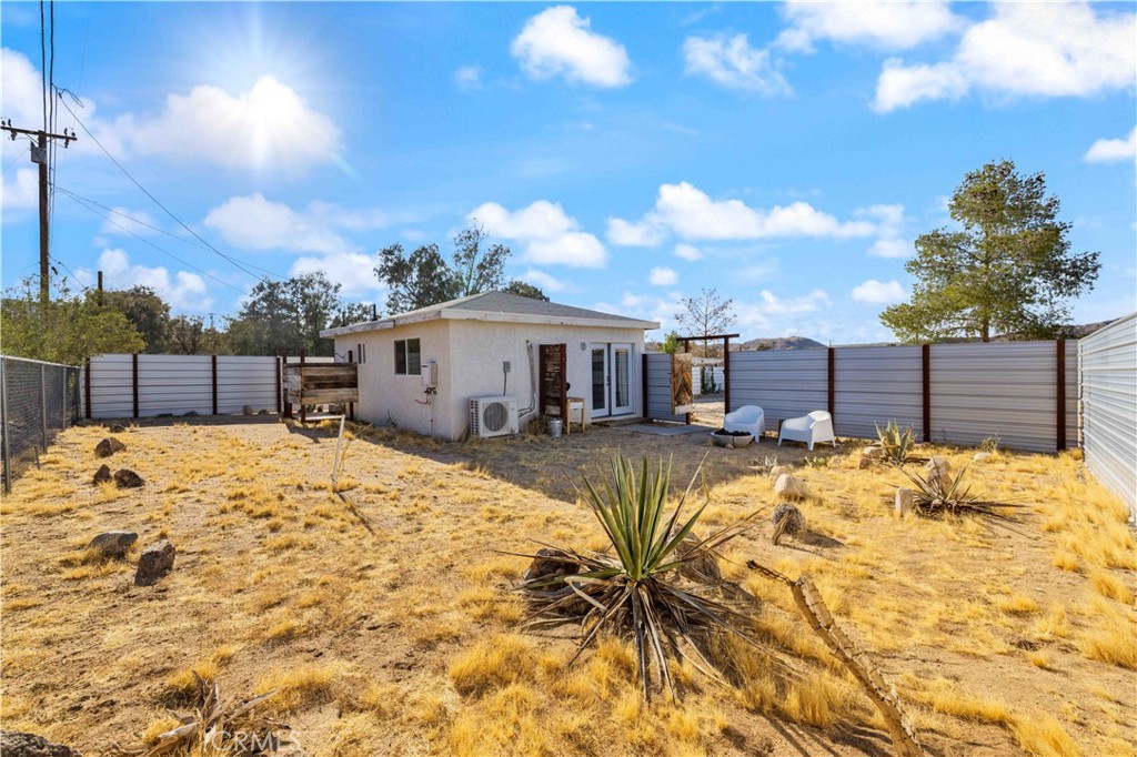 61879 Valley View Circle Joshua Tree, CA 92252 - Photo 31 of 63 a view of a house with a swimming pool
