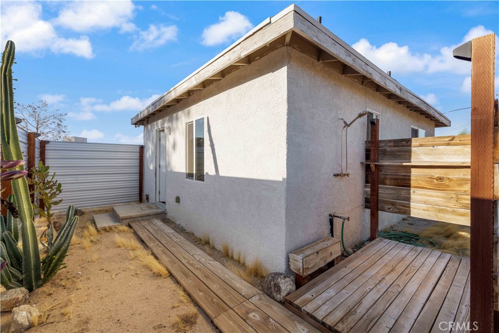 61879 Valley View Circle Joshua Tree, CA 92252 - Photo 38 of 63 a view of a house with a wooden deck