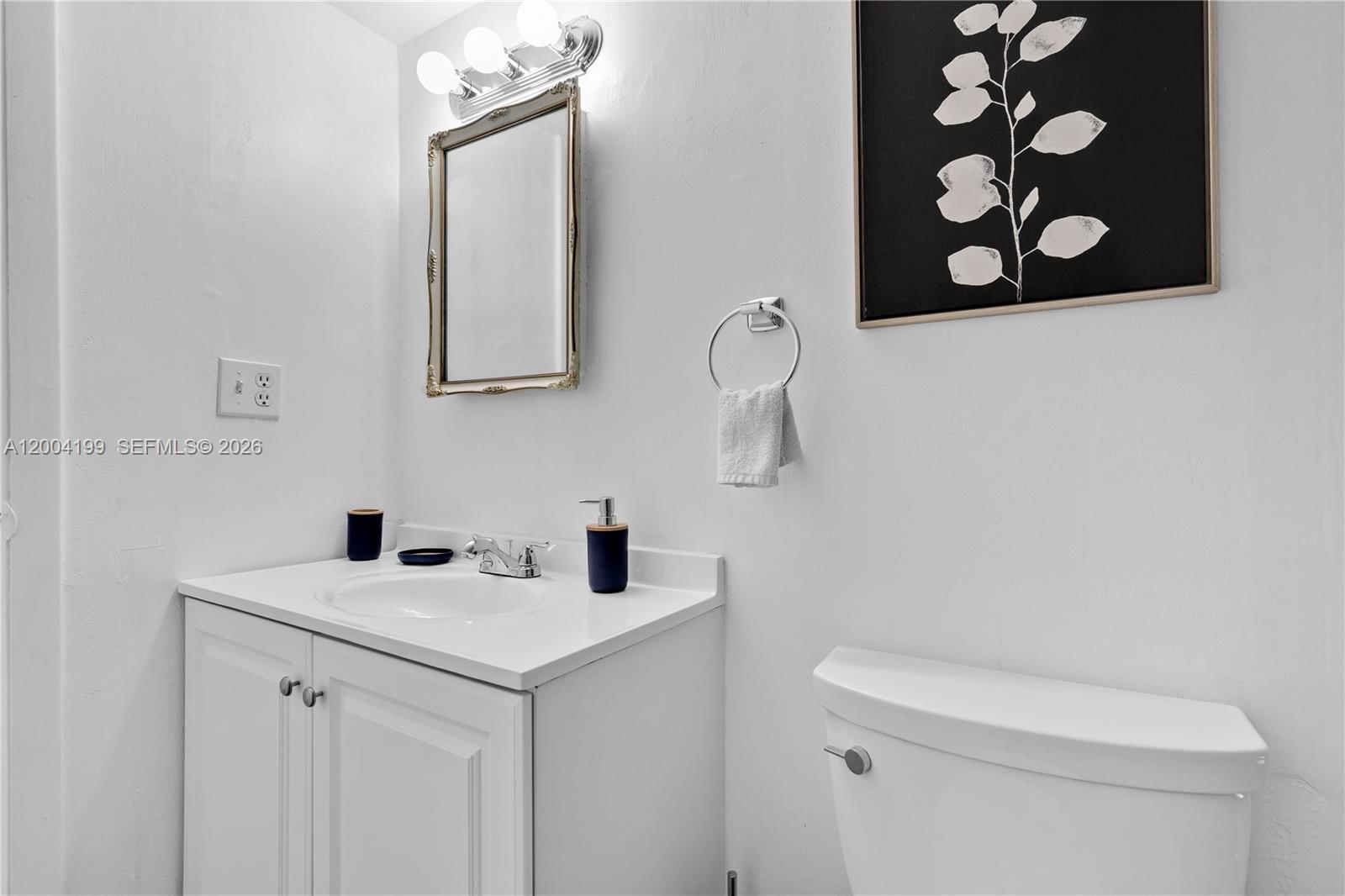 1841 Southwest 29th Avenue, Unit B Miami, FL 33145 - Photo 11 of 24 a bathroom with a sink vanity and toilet