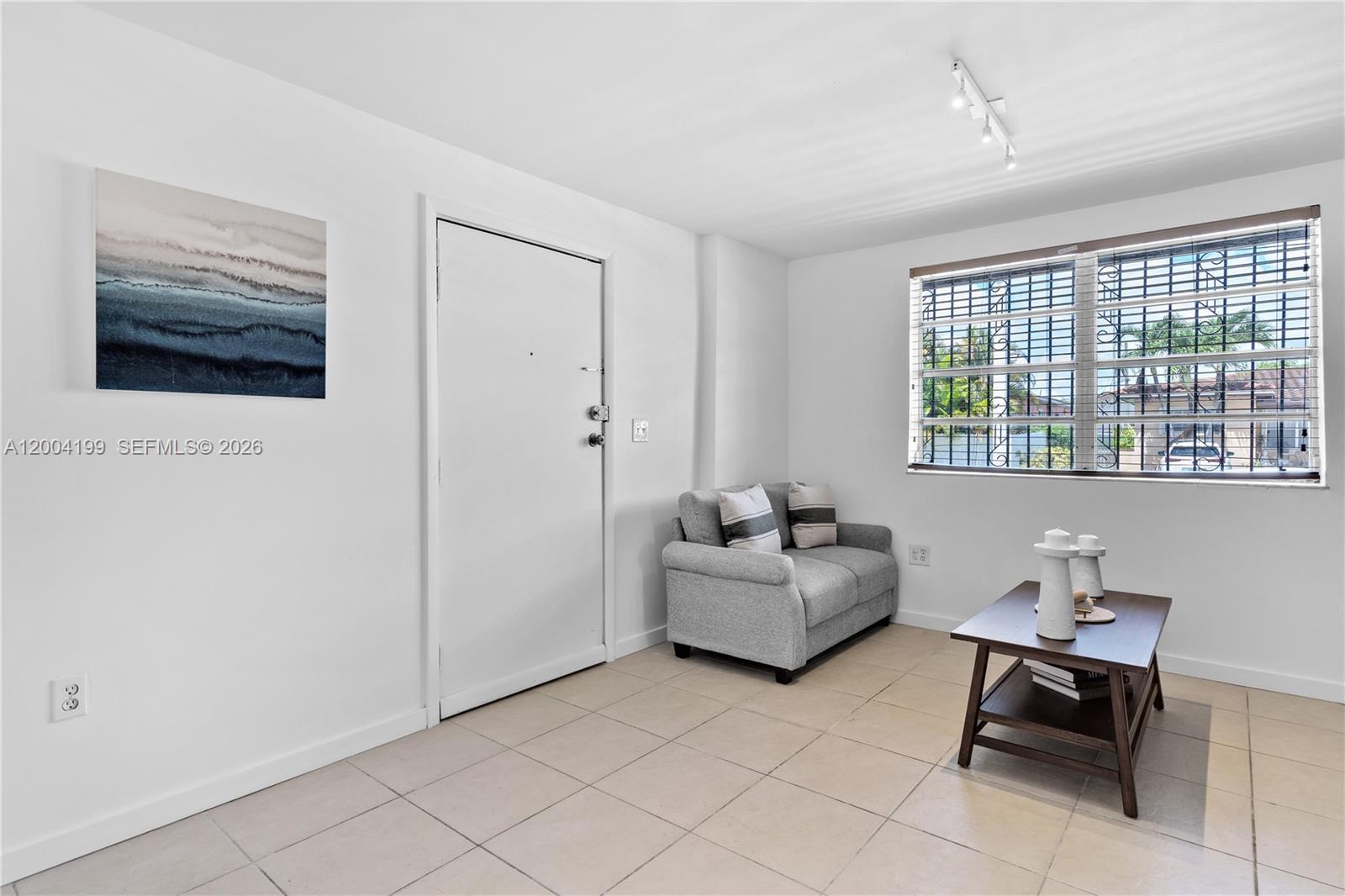1841 Southwest 29th Avenue, Unit B Miami, FL 33145 - Photo 9 of 24 a living room with furniture and a window