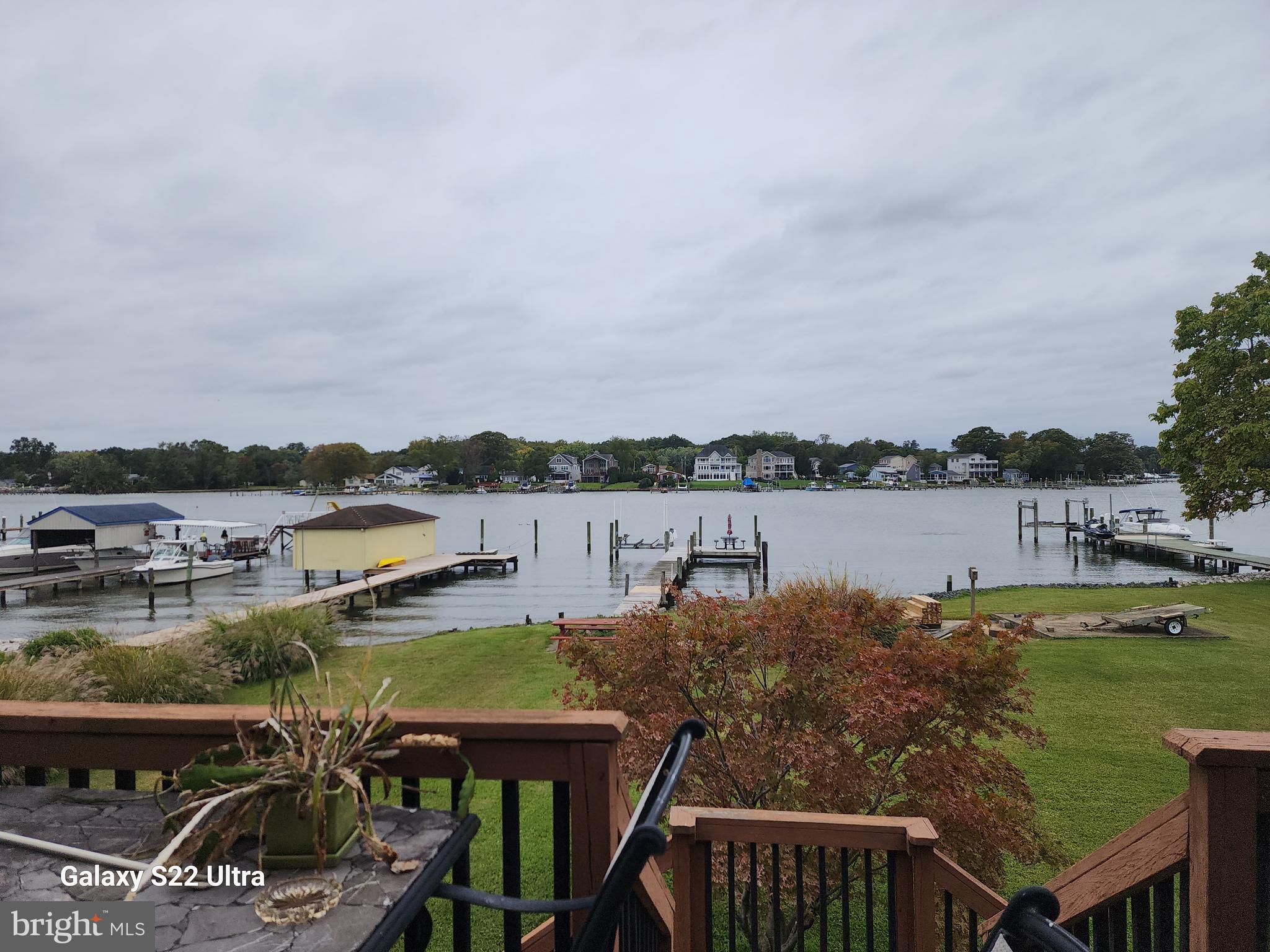 808 Seneca Park Road Baltimore, MD 21220 - Photo 12 of 15 a view of a lake with lawn chairs and a table