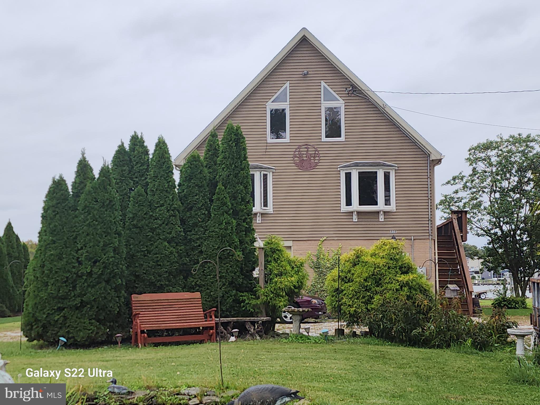 808 Seneca Park Road Baltimore, MD 21220 - Photo 5 of 15 a front view of a house with a yard