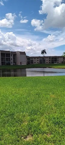 a kitchen with granite countertop a sink and a stove