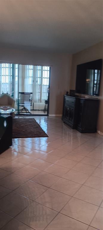 10145 Sunrise Lakes Boulevard, Unit 405 Sunrise, FL 33322 - Photo 22 of 48 a large kitchen with granite countertop a stove a sink and dishwasher