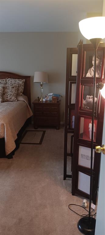 10145 Sunrise Lakes Boulevard, Unit 405 Sunrise, FL 33322 - Photo 26 of 48 a bedroom with a bed and a desk