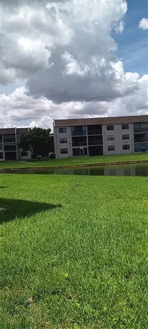 a bedroom with a bed and a night stand