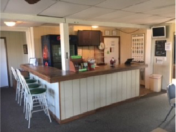 6236 Highway 38 DeKalb, IL 60115 - Photo 5 of 10 a dining hall with stainless steel appliances kitchen island granite countertop a table chairs in it and a window