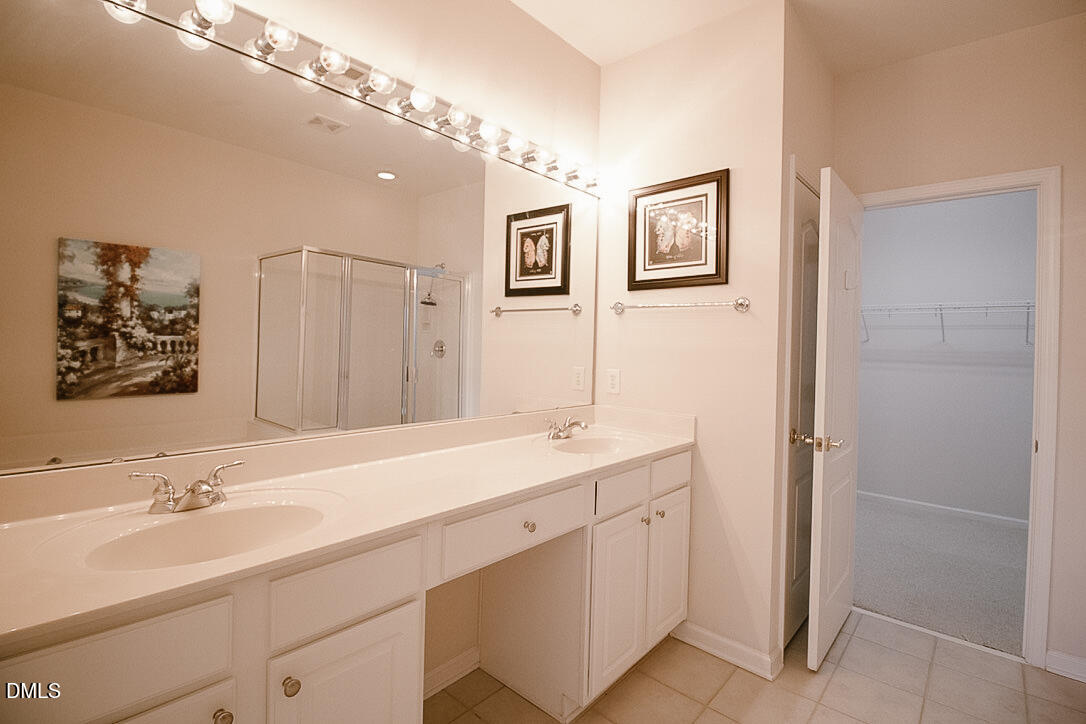 5335 Brandy Bay Road Raleigh, NC 27613 - Photo 13 of 29 a bathroom with a double vanity sink mirror and double