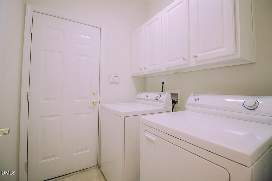 5335 Brandy Bay Road Raleigh, NC 27613 - Photo 16 of 29 a utility room with dryer and washer