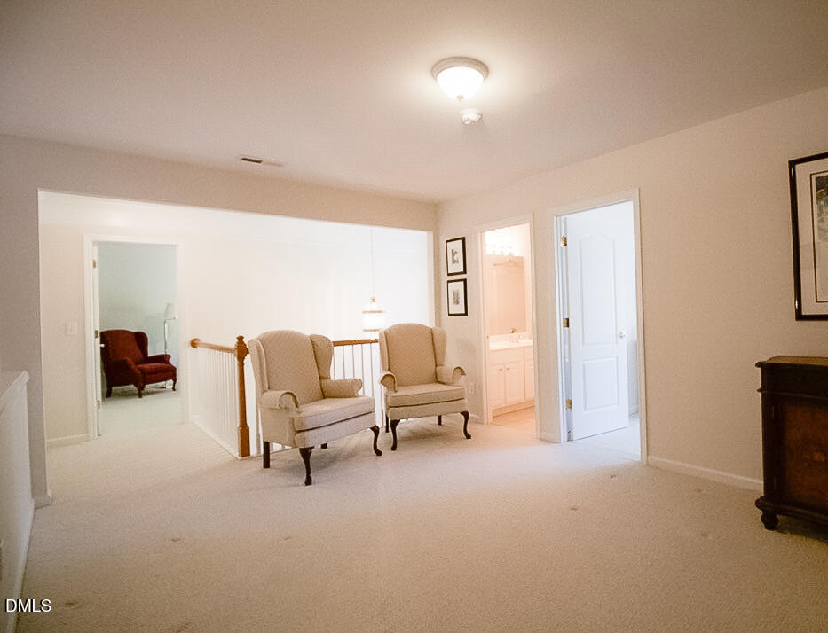 5335 Brandy Bay Road Raleigh, NC 27613 - Photo 18 of 29 a living room with furniture and a flat screen tv