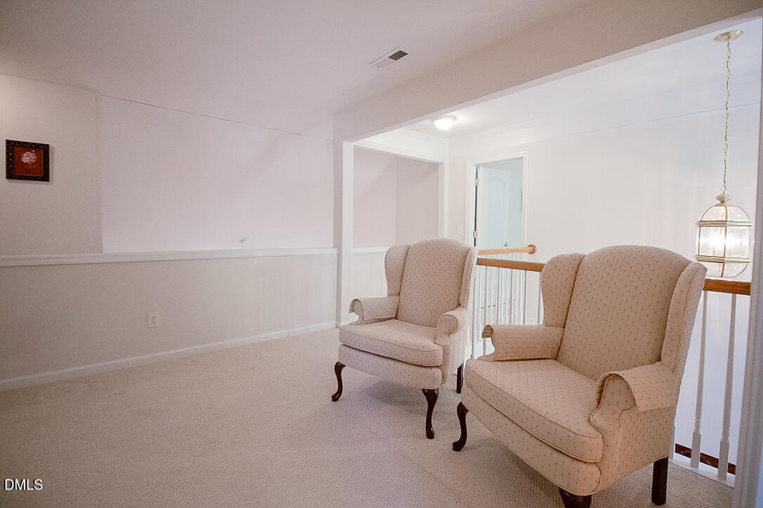 5335 Brandy Bay Road Raleigh, NC 27613 - Photo 19 of 29 a living room with furniture and a couch