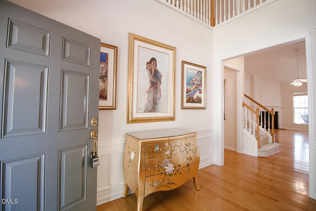 5335 Brandy Bay Road Raleigh, NC 27613 - Photo 2 of 29 a view of a hallway with wooden floor and windows