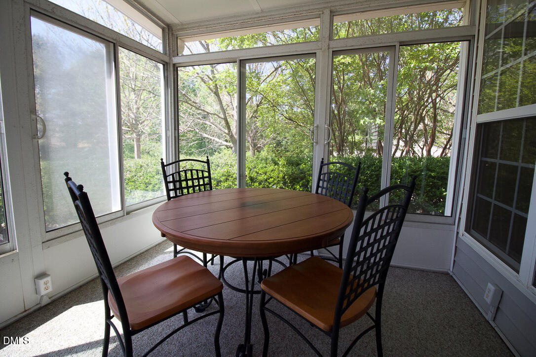 5335 Brandy Bay Road Raleigh, NC 27613 - Photo 25 of 29 a view of a dining room with furniture and a window