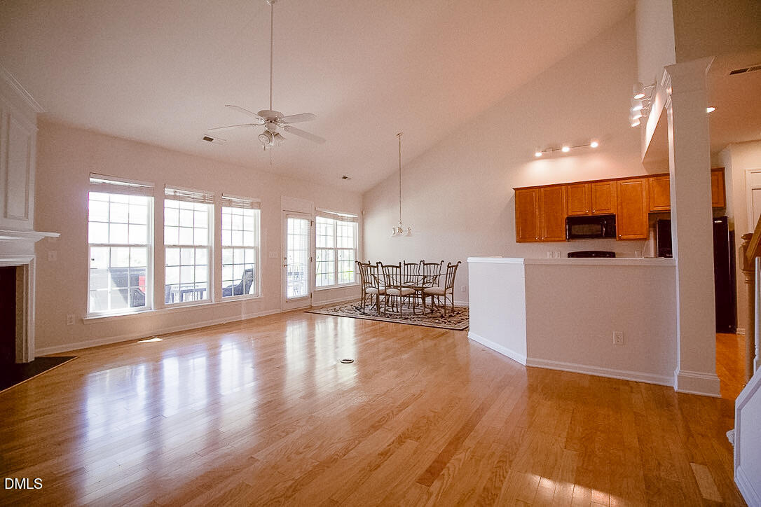 5335 Brandy Bay Road Raleigh, NC 27613 - Photo 8 of 29 a view of a kitchen with dining table and chairs