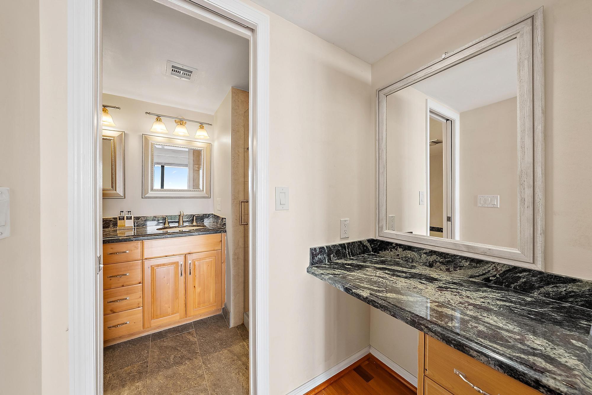 356 Golfview Road, Unit 805 North Palm Beach, FL 33408 - Photo 14 of 26 a bathroom with a granite countertop sink and a mirror