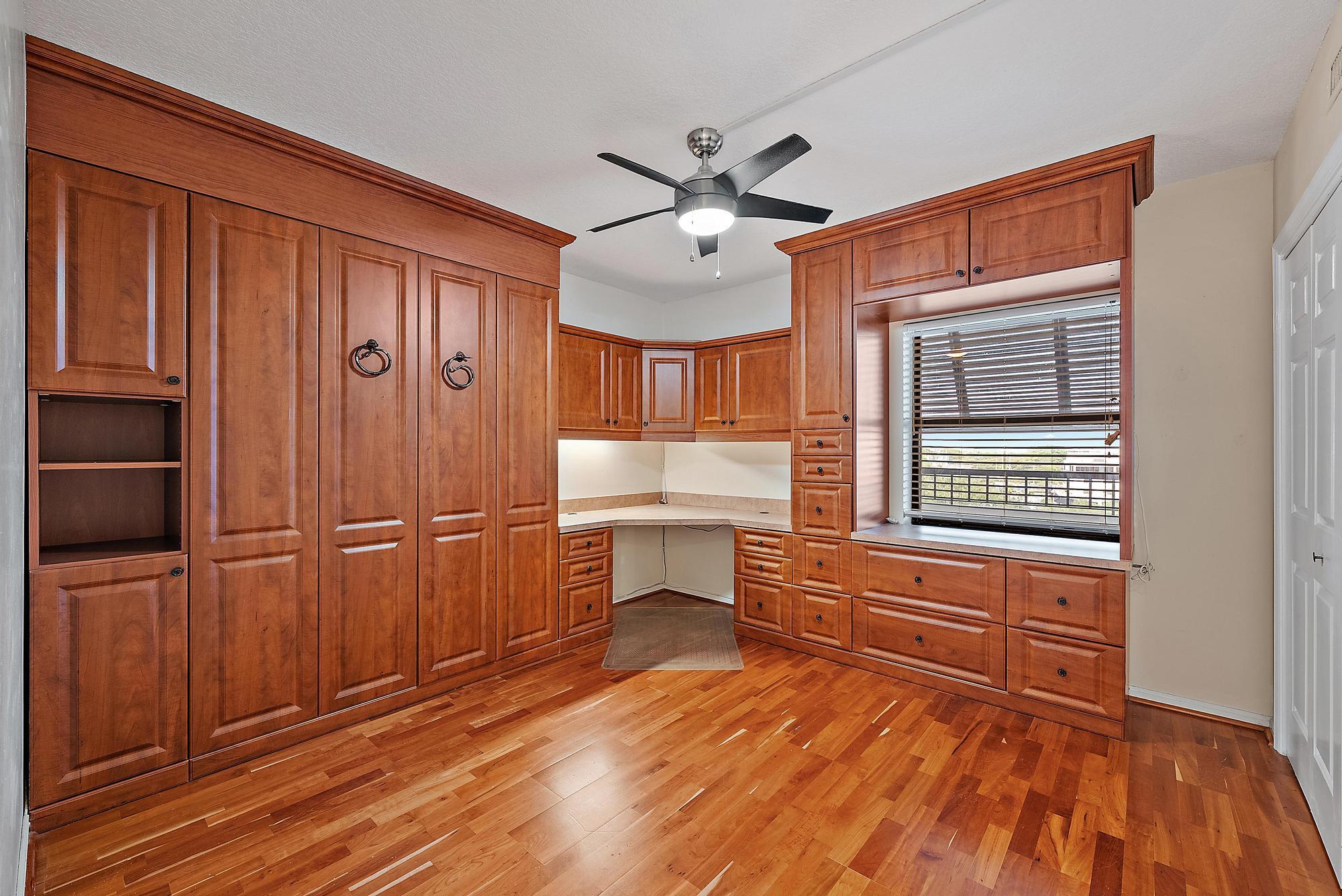 356 Golfview Road, Unit 805 North Palm Beach, FL 33408 - Photo 16 of 26 a room with wooden floor and window