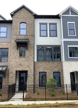 a front view of a house with glass windows