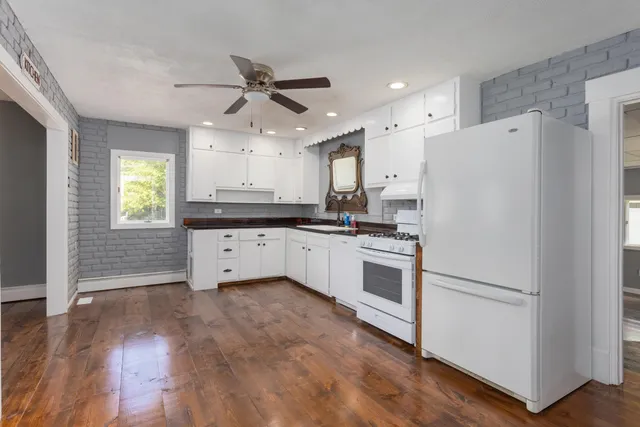 a view of kitchen with wooden floor