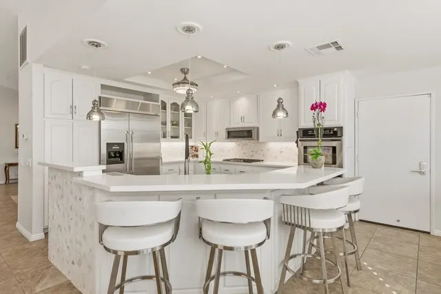 an aerial view of residential house and sandy dunes