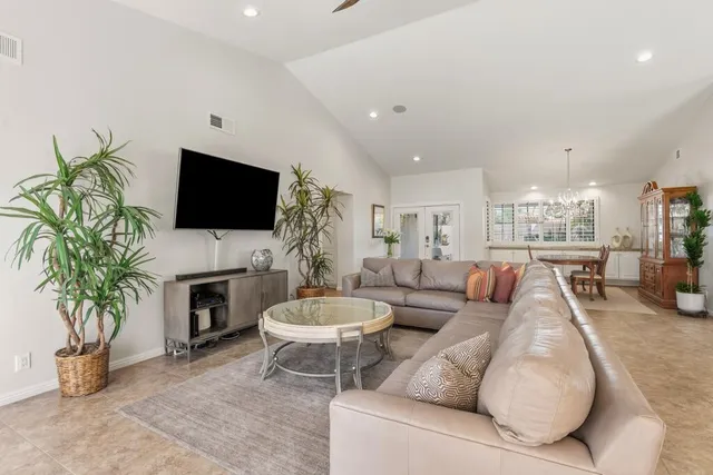 a bathroom with double vanity sinks a vanity two mirror and a shower