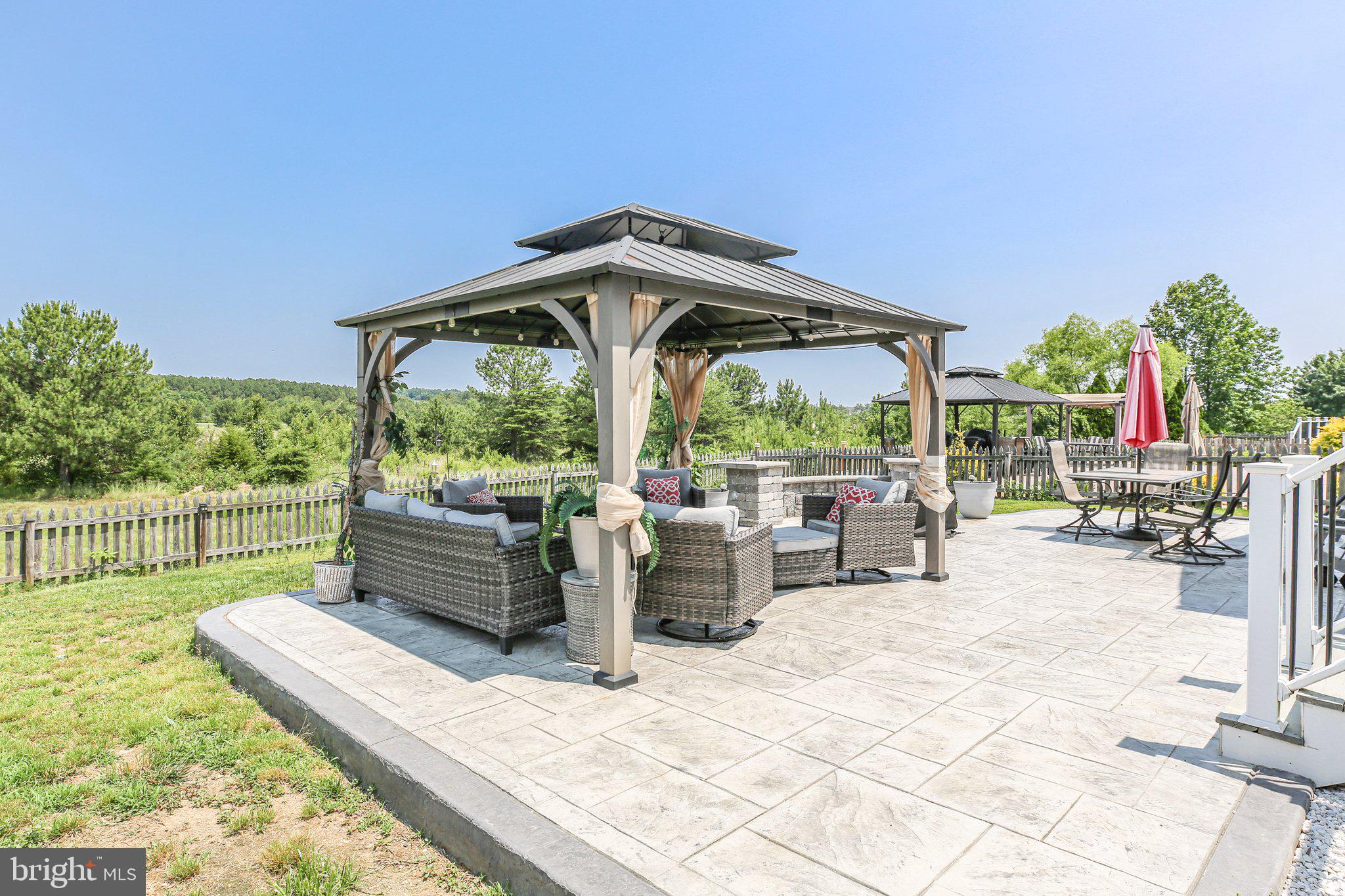 5233 Windbreak Drive Fredericksburg, VA 22407 - Photo 2 of 53 a view of a patio with chairs and plants