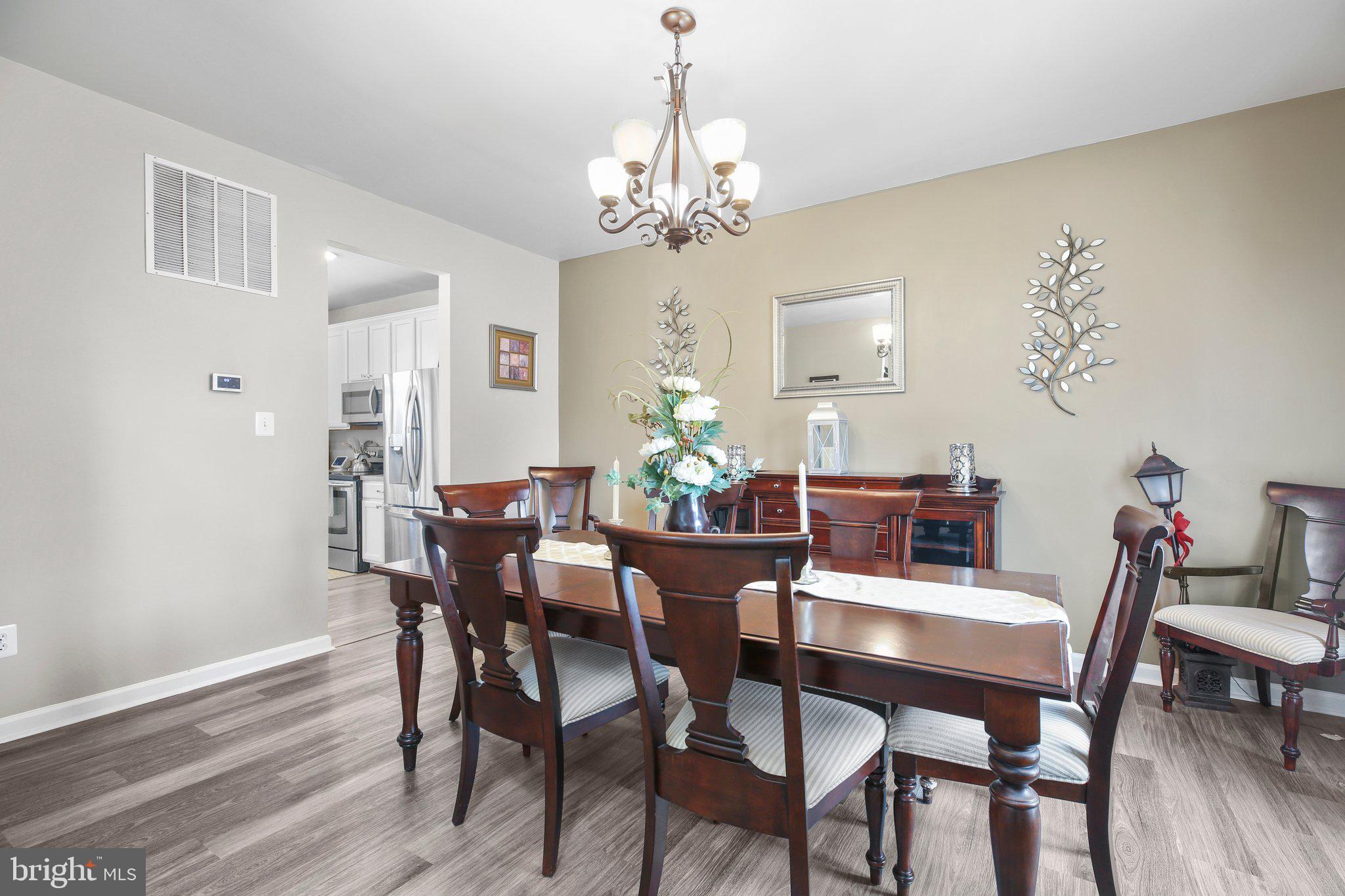 5233 Windbreak Drive Fredericksburg, VA 22407 - Photo 26 of 53 a view of a dining room with furniture and wooden floor
