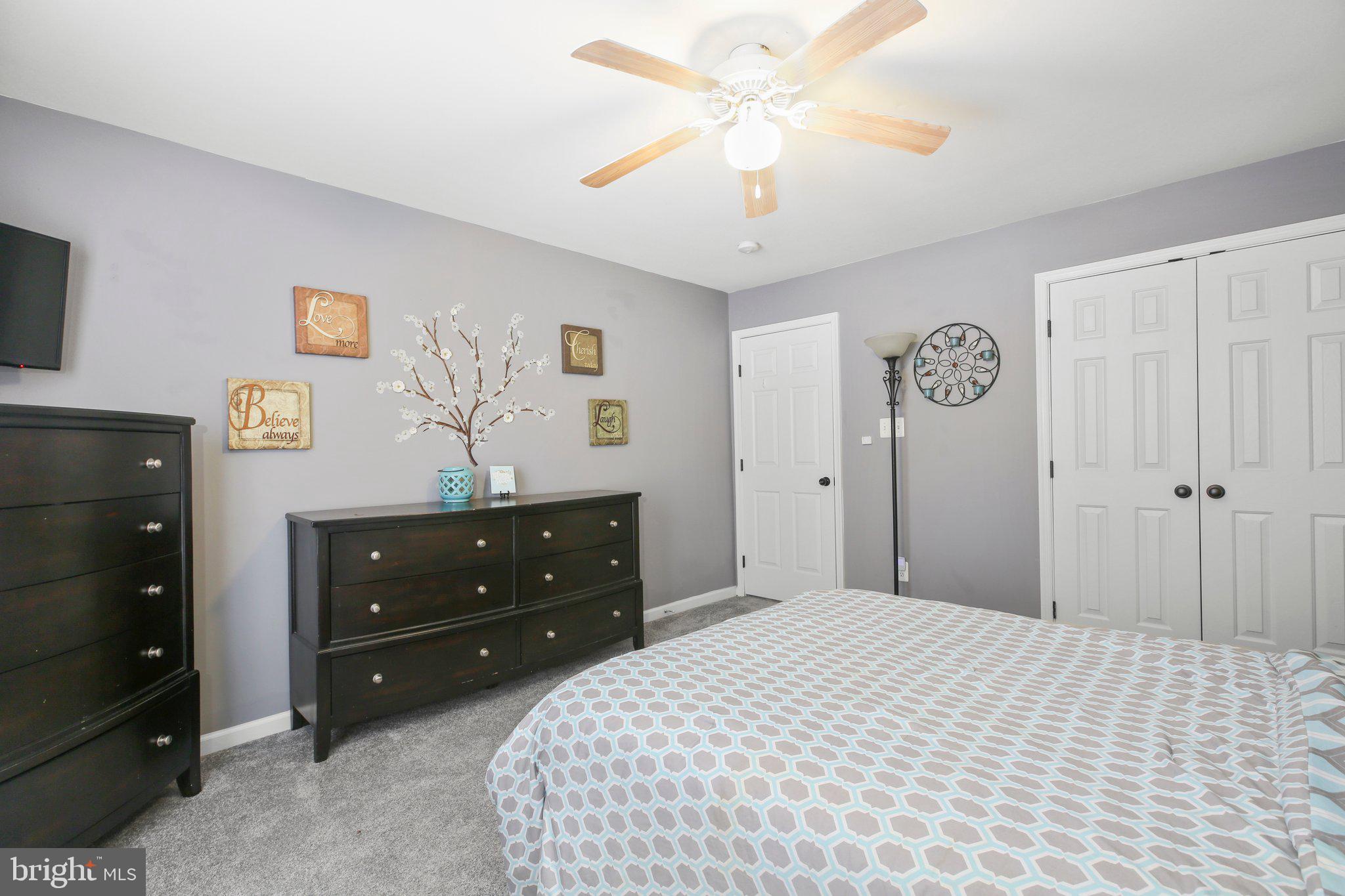 5233 Windbreak Drive Fredericksburg, VA 22407 - Photo 33 of 53 a bedroom with a bed and a dresser