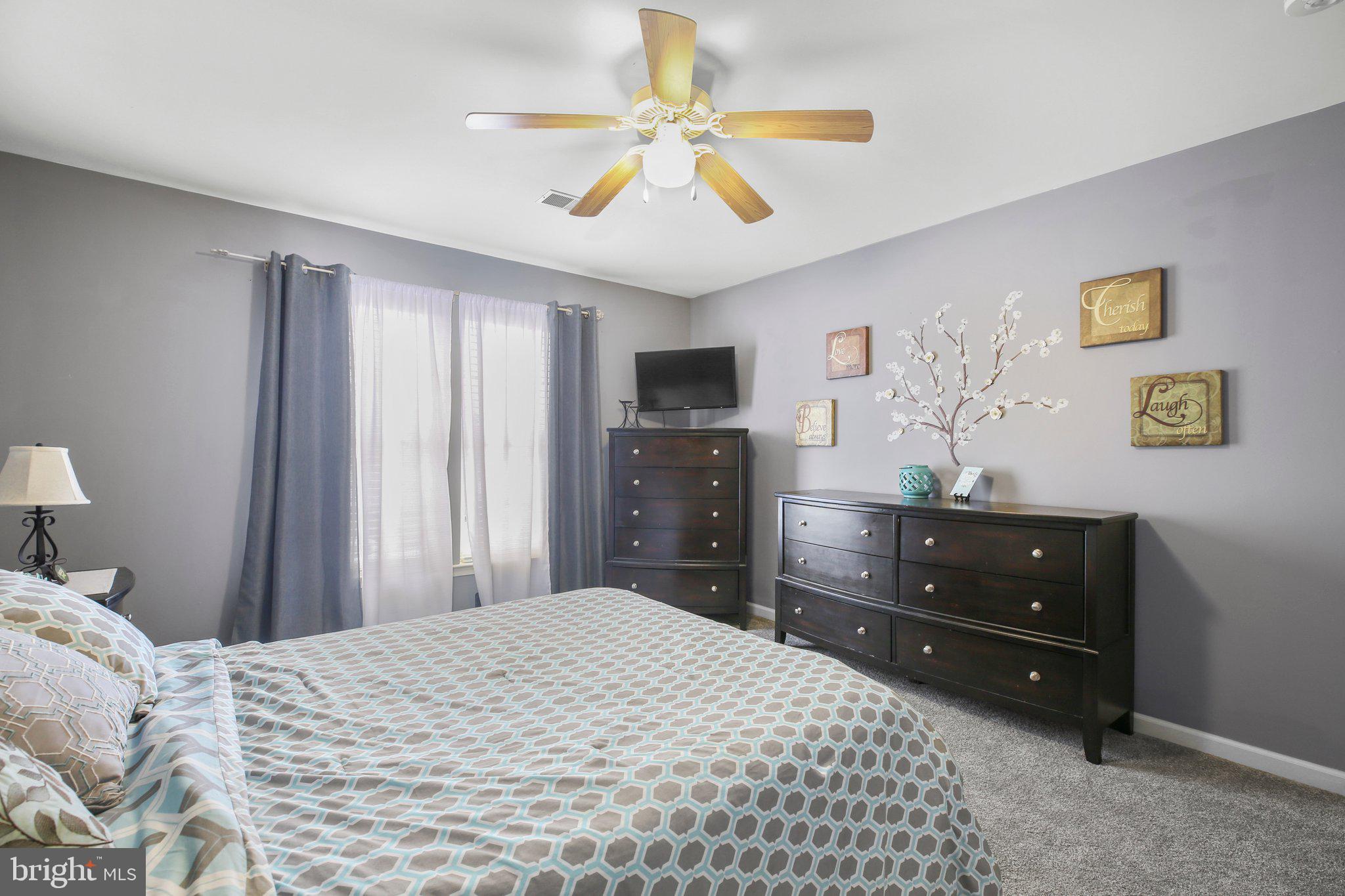 5233 Windbreak Drive Fredericksburg, VA 22407 - Photo 34 of 53 a bedroom with a bed and a dresser