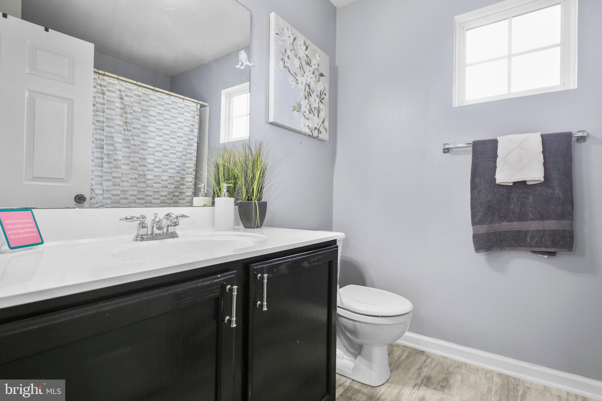 5233 Windbreak Drive Fredericksburg, VA 22407 - Photo 36 of 53 a bathroom with a granite countertop sink a toilet and a mirror