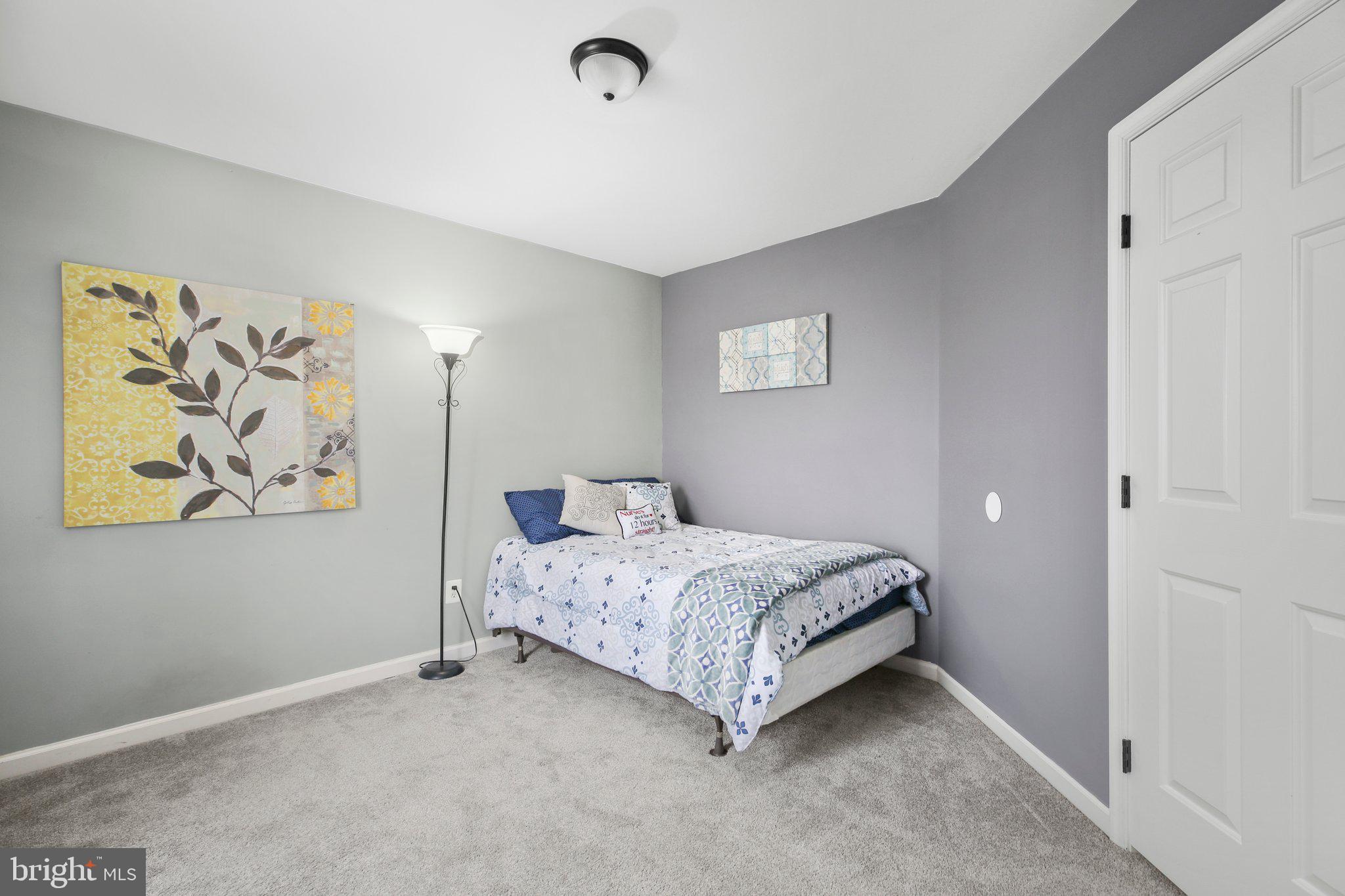 5233 Windbreak Drive Fredericksburg, VA 22407 - Photo 38 of 53 a room with a bed and a window