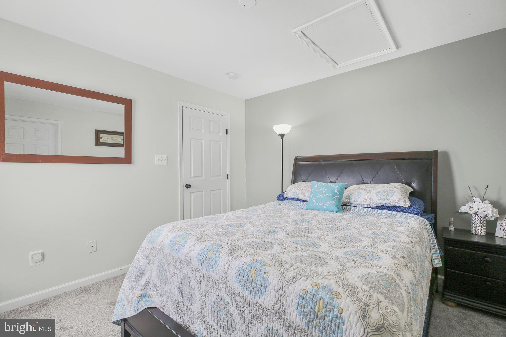 5233 Windbreak Drive Fredericksburg, VA 22407 - Photo 39 of 53 a large bed sitting in a bedroom next to a window