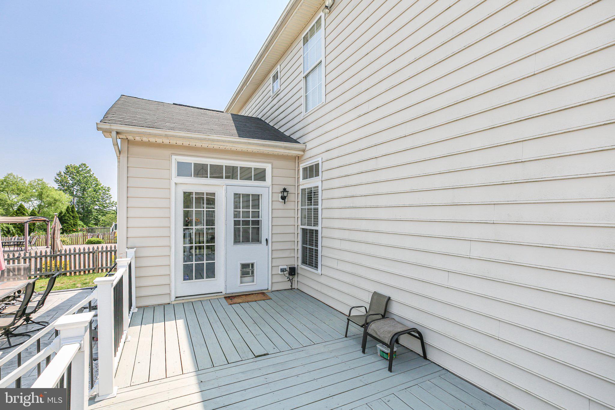5233 Windbreak Drive Fredericksburg, VA 22407 - Photo 53 of 53 a view of a deck with wooden floor and fence next to a yard
