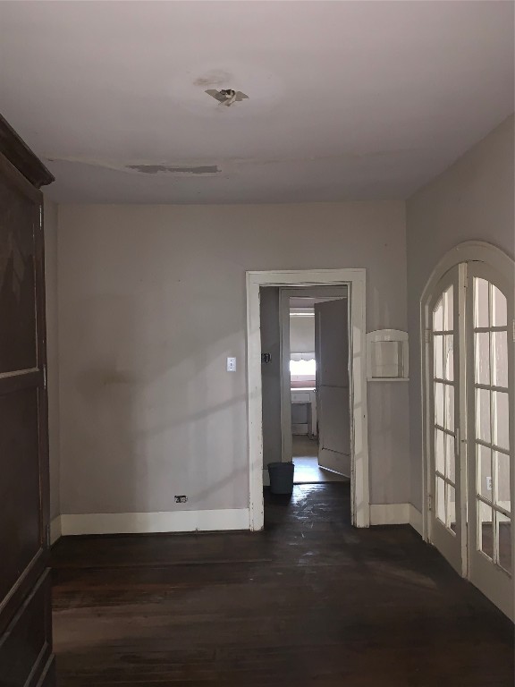 22720 Hudson Road New Caney, TX 77357 - Photo 13 of 40 an empty room with wooden floor and windows