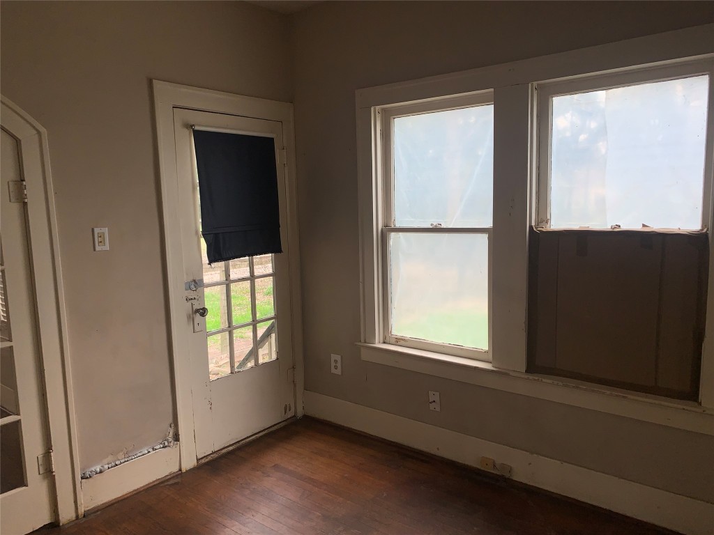 22720 Hudson Road New Caney, TX 77357 - Photo 15 of 40 an empty room with wooden floor and windows