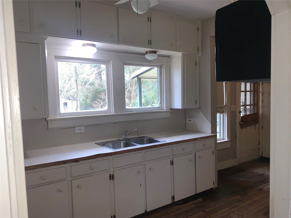 22720 Hudson Road New Caney, TX 77357 - Photo 17 of 40 a kitchen with a sink window and cabinets