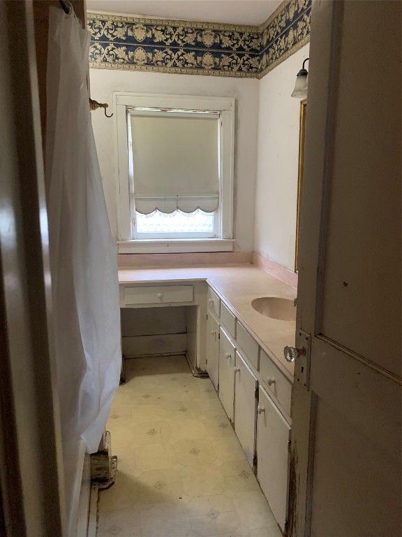 22720 Hudson Road New Caney, TX 77357 - Photo 33 of 40 a bathroom with a sink a toilet and vanity