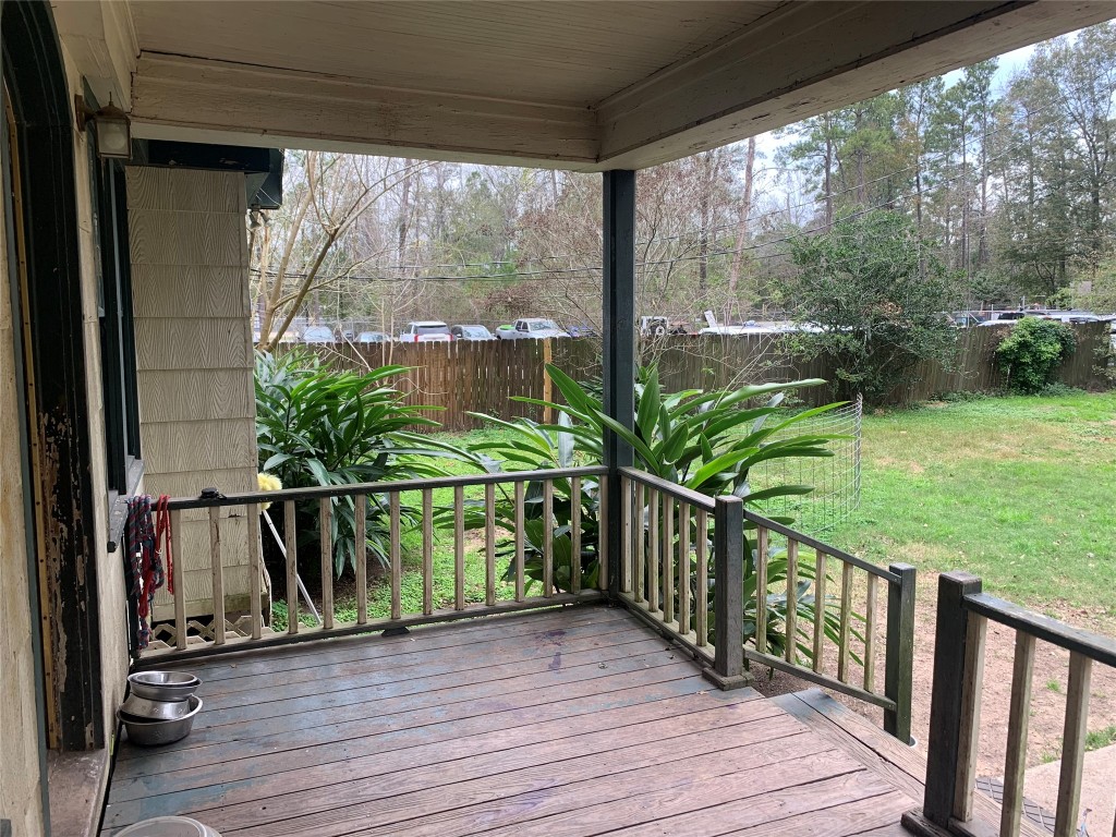 22720 Hudson Road New Caney, TX 77357 - Photo 35 of 40 a view of a balcony with wooden floor